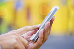 Image of person holding mobile phone